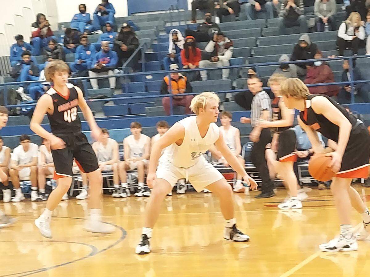 Highland sophomore guard Jake Ottensmeier looks to drive past Jerseyville’s Tanner Brunaugh during an IHSA Class 3A regional semifinal game Wednesday, Feb. 23, at Cahokia High School. Ottensmeier helped lead the Bulldogs past the Panthers 60-46.