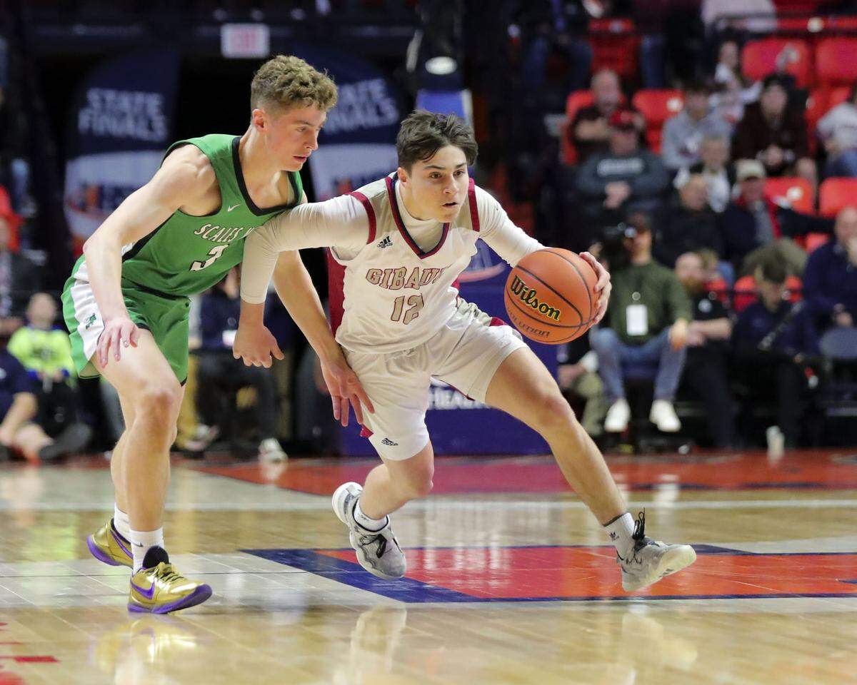 Gibault’s Kanen Augustine brings the ball up court during Saturday’s IHSA Class 1A state championship game against Scales Mounds at the State Farm Center on the campus of the University of Illinois. Gibault ultimately prevailed 65-45 to claim the state title.