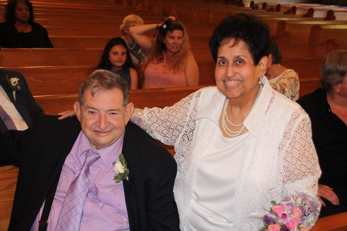 Joe Hubbard and Julie Llamas pose for one last photo as single people. They got married Friday night at St. Henry's Catholic Church in Belleville.