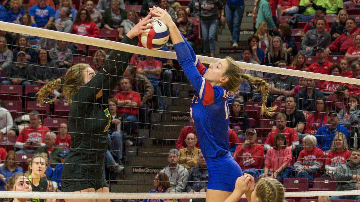 Nashville junior  Delaney Varel goes up for a block in the Hornets’ loss Saturday to Champaign St. Thomas More in the Class 2A third-place match.