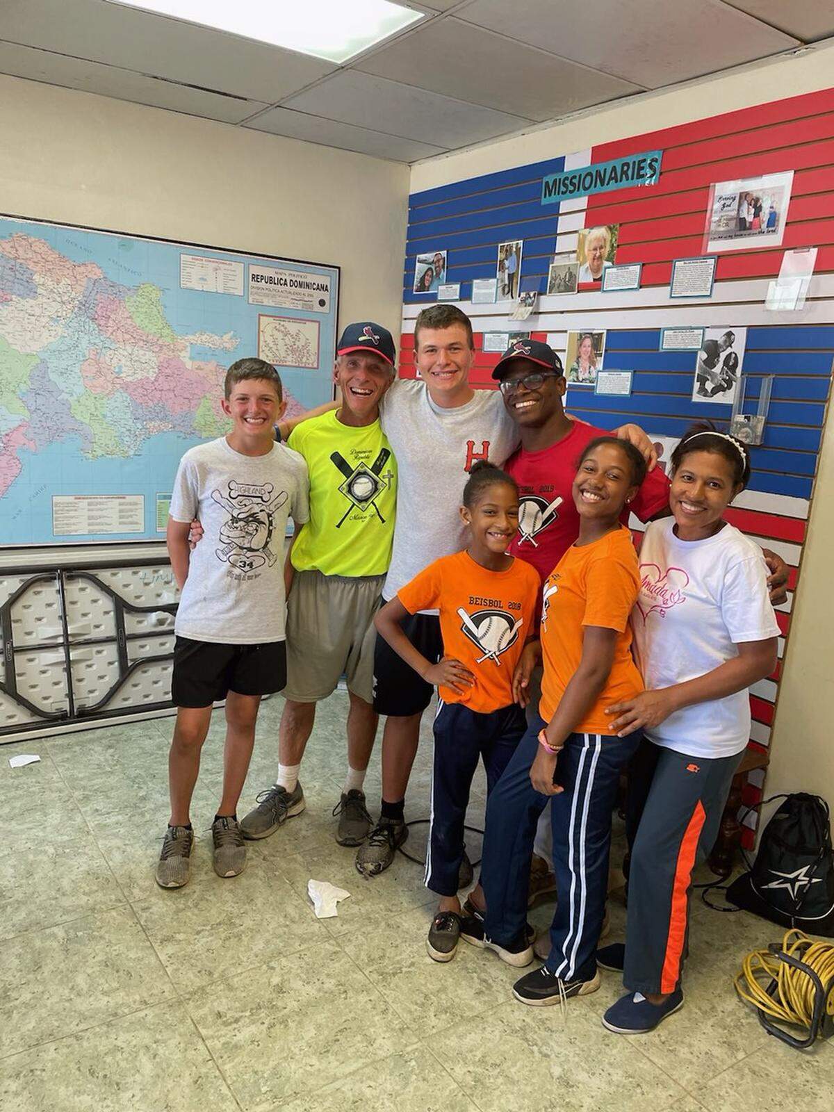 For the past 10 years, Highland High School baseball coach Joel Hawkins has taken a week-long trip each summer to the Dominican Republic to help conduct baseball camps with several American and Dominican coaches and current HHS players and former players. Pictured is Hawkins with his two sons, Blaise and Abe, along with Alberto Felix and his wife, Lillian, and two daughters, Abigail and Ruby.