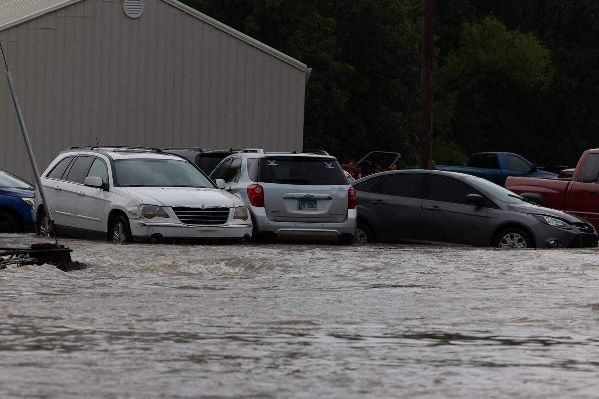 Flooding along E. St. Louis St. in Nashville, Ill., along the path where the dam spilled over, on July 16, 2024.