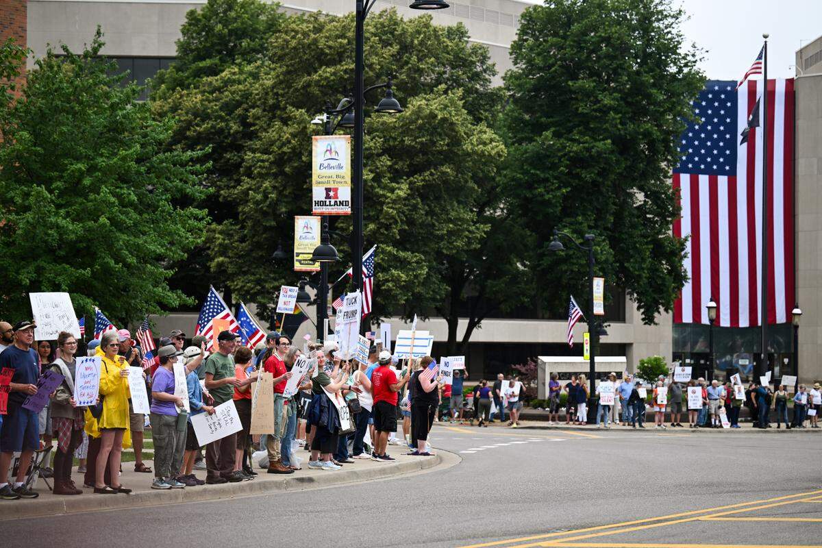Protesters rally against President Donald Trump at the “No Kings” protest in Belleville’s Public Square Saturday, June 14, 2025.
