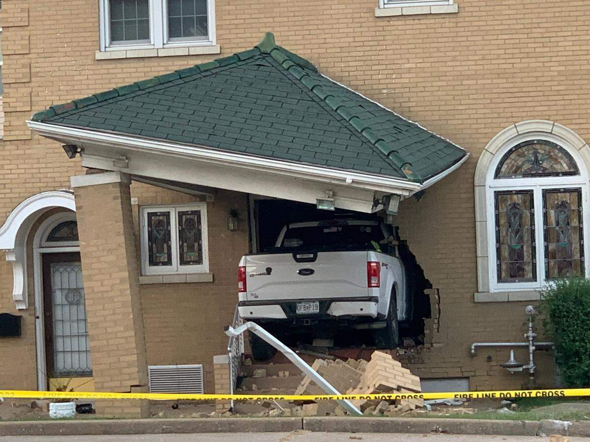 A white Ford truck that crashed into Kassly-Meridith Funeral Home in Collinsville on Aug. 22, 2021, remained lodged in the side of the building for two days.