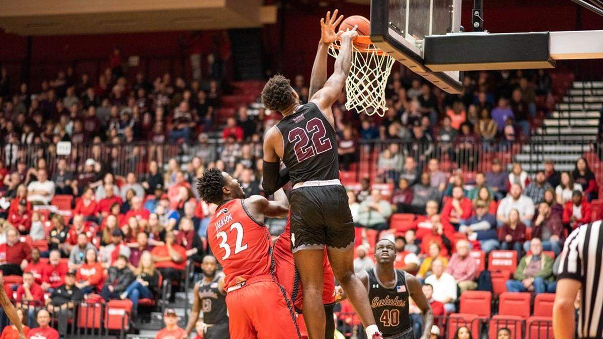 Armon Fletcher (22) of SIU-Carbondale scores against SIU-Edwardsville Saturday. Fletcher, who graduated from Edwardsville High School in 2014, was 5-for-5 from behind the 3-point line and scored a season-high 24 points as the Salukis ran to an 82-61 win over the SIU-Edwardsville Cougars.