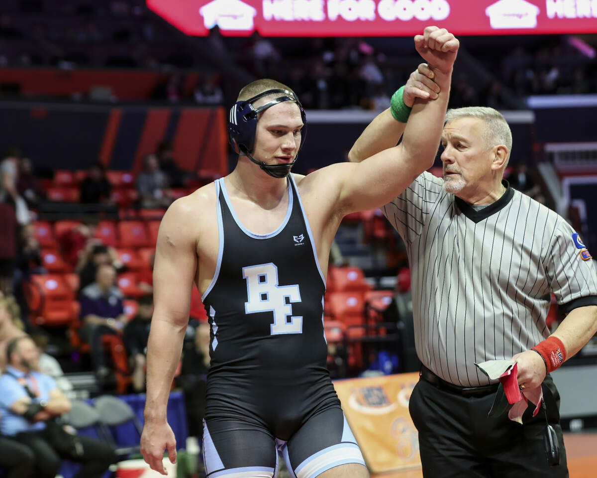 Belleville East’s Dominic Thebeau has his hand raised after defeating St. Charles East’s Brandon Swartz during their quarterfinal match at the 2023 IHSA Individual Wrestling State Finals on Friday in Champaign.