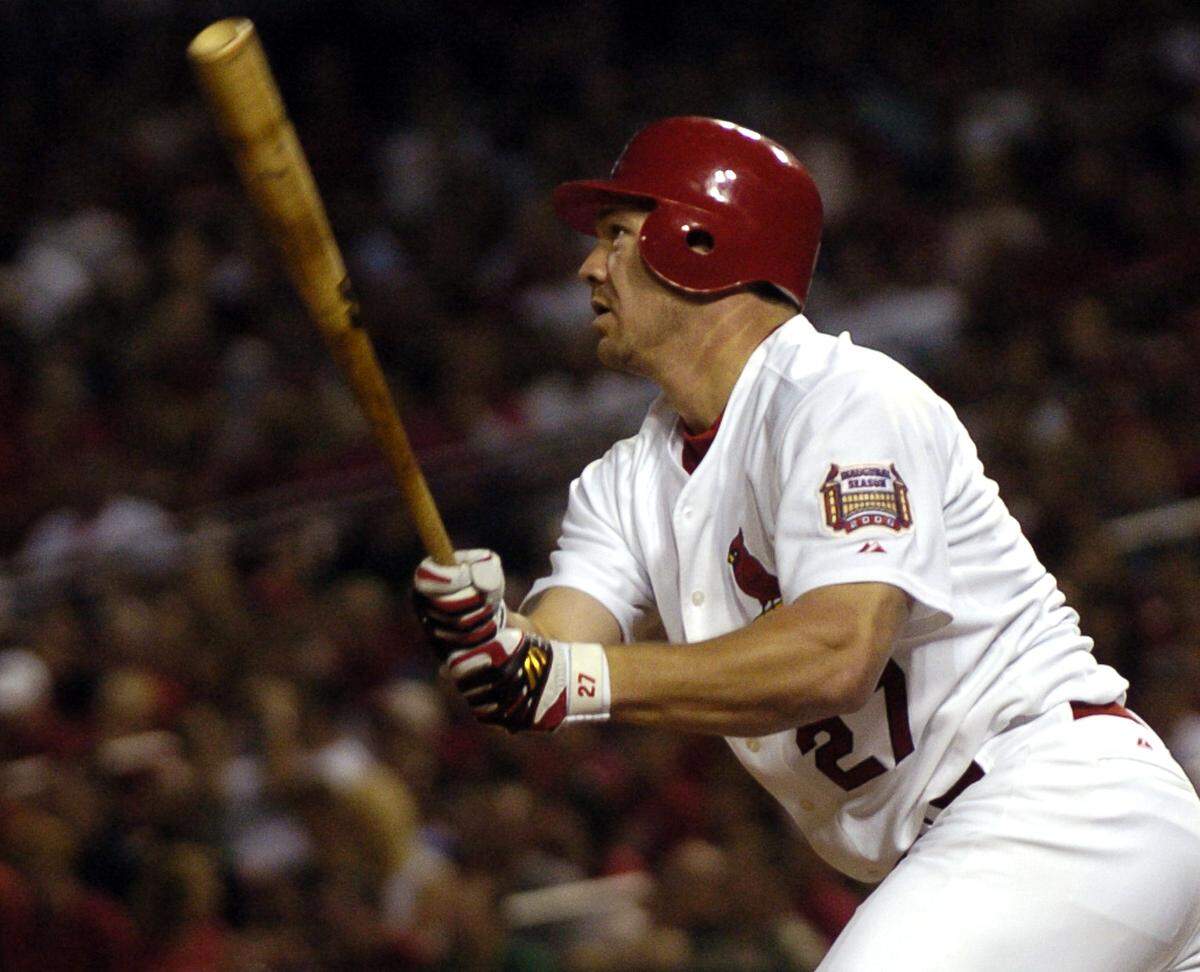 St. Louis Cardinals Scott Rolen follows through on his first inning 3-run home run off San Francisco Giants Brad Hennessey during a baseball game on Friday, Sep. 15, 2006, in St. Louis. Rolen’s home run also scored Albert Pujols and Scott Spiezio. (AP Photo/Kyle Ericson)