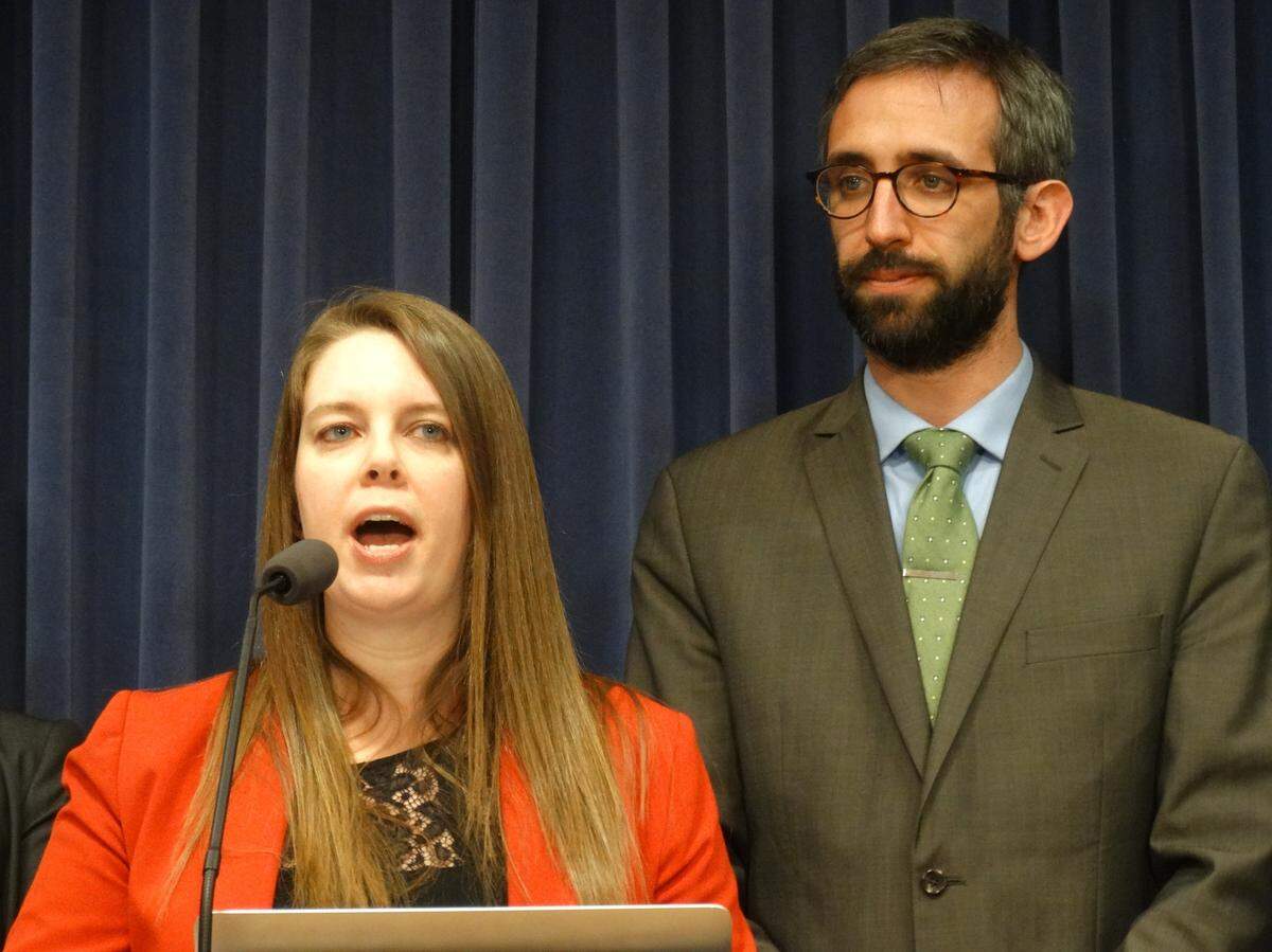 Claire McAndrews, director of campaigns and partnerships at Families USA, and Rep. Will Guzzardi, a Chicago Democrat, speak during a news conference Wednesday announcing a package of Democratic bills to rein in the spiraling cost of prescription drug prices in Illinois.