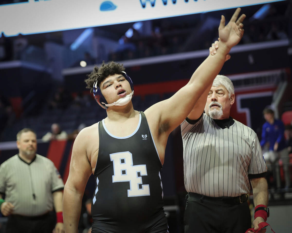 Belleville East’s Jonathan Rulo has his hand raised after defeating Marmion Academy’s Sean Scheck during their quarterfinal match at the 2023 IHSA Individual Wrestling State Finals on Friday. Rulo won by fall at 3:17.