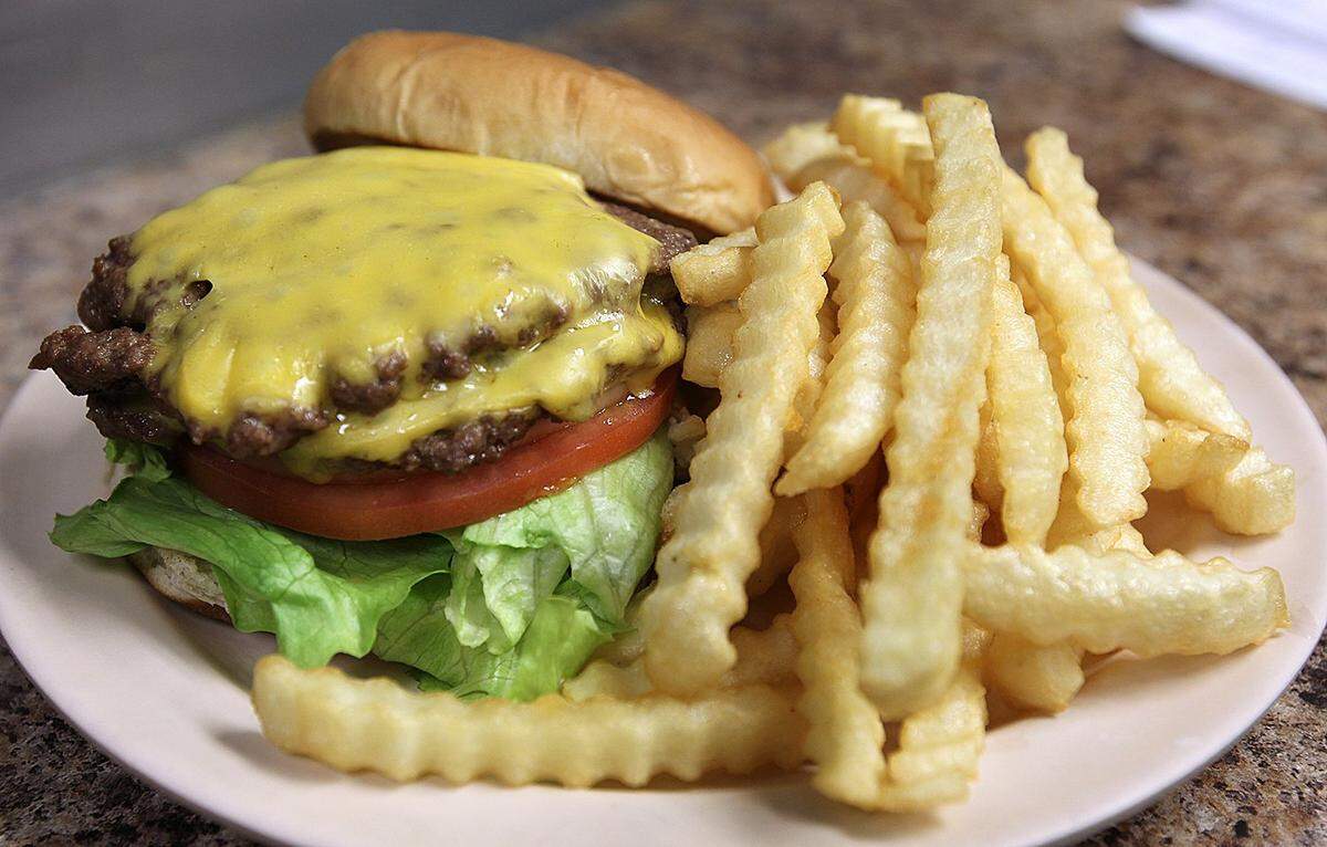 A double cheeseburger and an order of french fries at Wally’s Drive-In in Breese