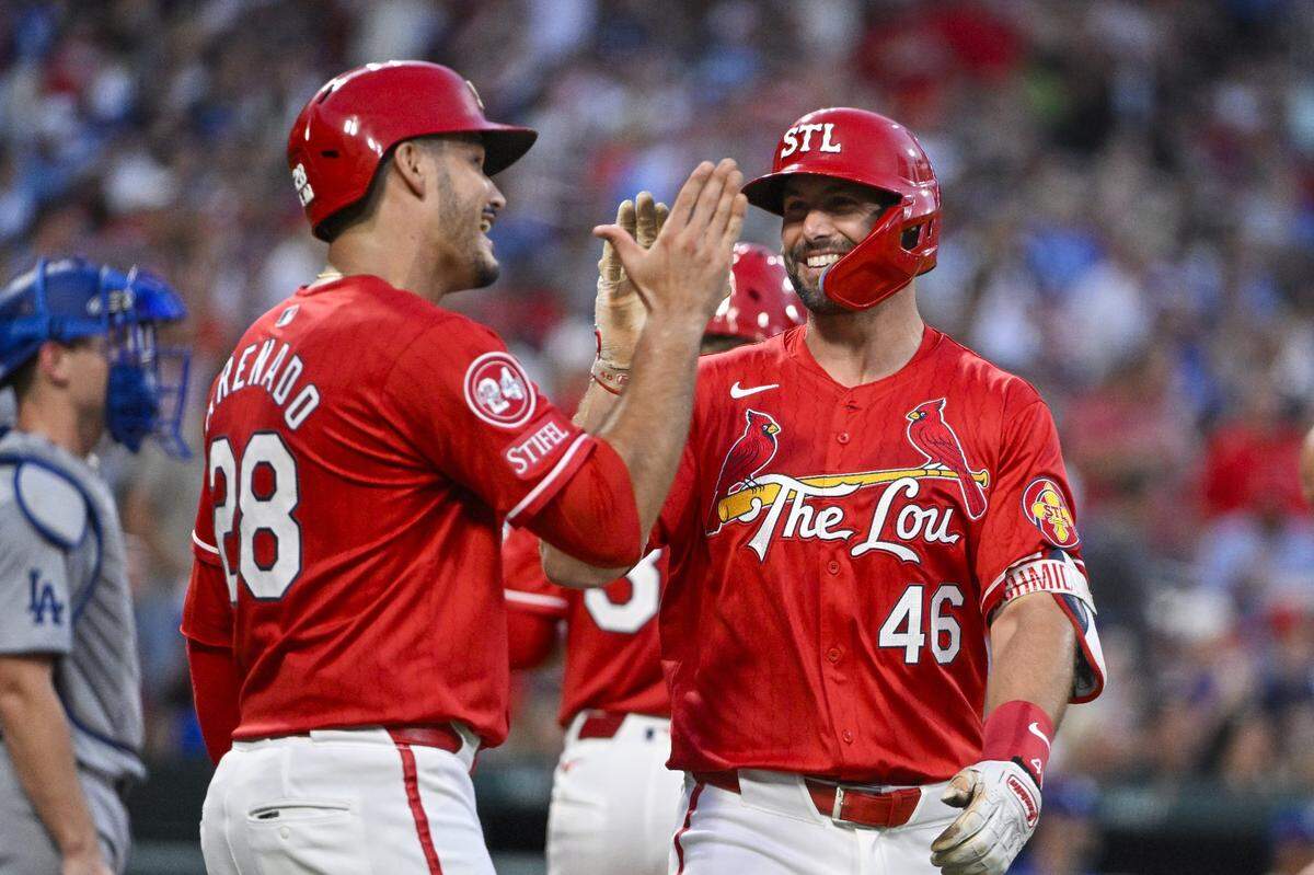 Aug 16, 2024; St. Louis, Missouri, USA;  St. Louis Cardinals first baseman Paul Goldschmidt (46) celebrates with third baseman Nolan Arenado (28) after hitting a two run home run against the Los Angeles Dodgers during the second inning at Busch Stadium. Mandatory Credit: Jeff Curry-USA TODAY Sports