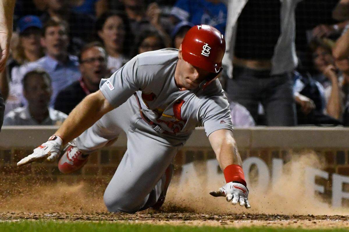 St. Louis Cardinals’ Paul Goldschmidt (46) scores during the sixth inning of a baseball game against the Chicago Cubs Thursday, Sept. 19, 2019, in Chicago. (AP Photo/Matt Marton)
