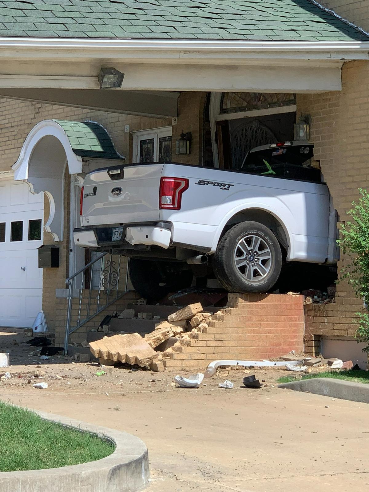 A white Ford truck that crashed into Kassley-Meridith Funeral Home in Collinsville early Sunday was still lodged in the building on Monday.