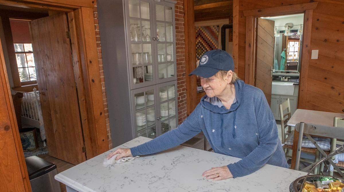 Linda Weisenstein cleans a kitchen counter at her Airbnb at 626 E. Garfield St. in Old Belleville Historic District. She’s hosted guests from all over the United States, Canada and Japan.