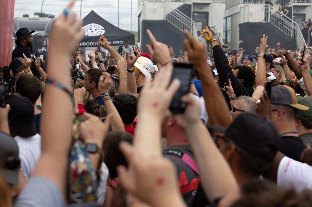 Thousands of fans put their hands in the air to welcome rap artist and actor Ludacris after the Enjoy Illinois 300 Cup Race at WorldWide Technology Raceway in Madison, Ill. on June 1, 2024.