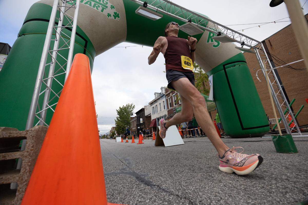 A half-marathoner crosses the finish line at the Belleville Marathon on Sept. 28, 2024.