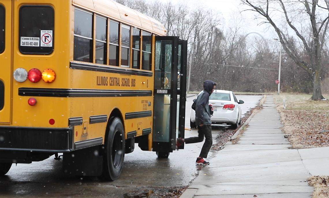 One of Mamie Cosey’s three great-grandchildren exits the bus near her East St. Louis home. For two years, Cosey, along with others in a group called Parents United for Change, started pushing for busing for more students in East St. Louis District 189.