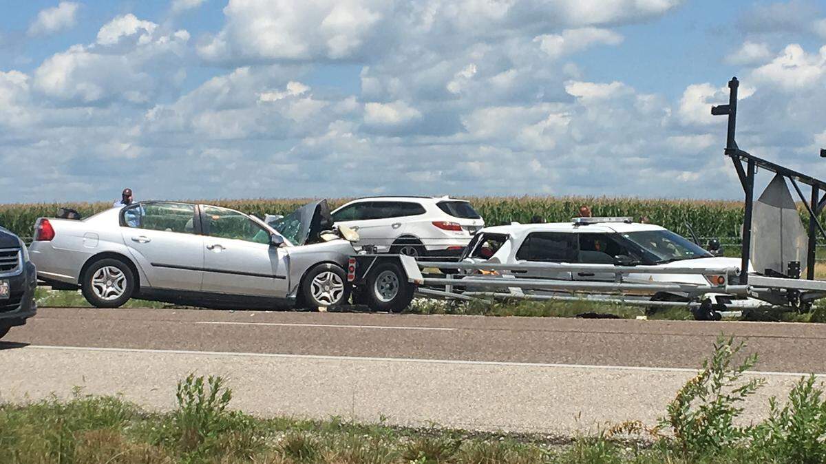 The trooper’s Ford Explorer, on the right, and another vehicle involved in the crash.
