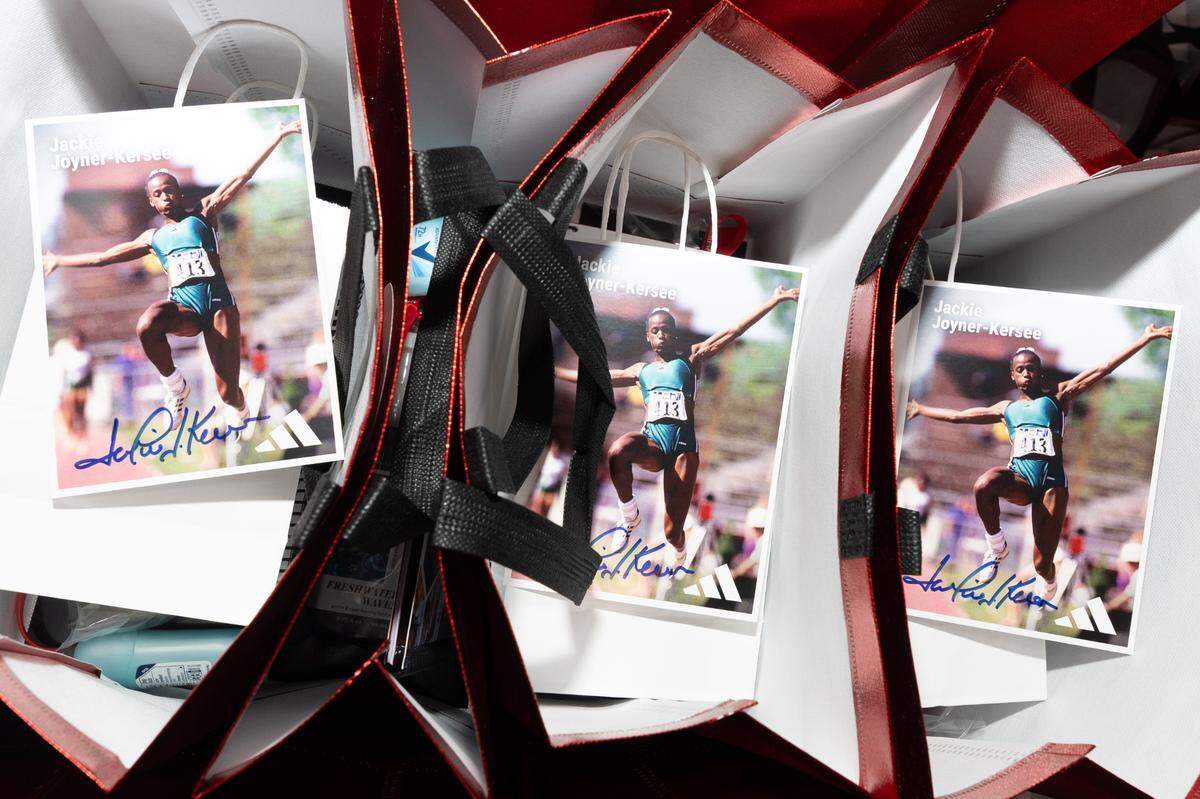 Photos of Jackie Joyner-Kersee, one of the most decorated female athletes in history, sit on top of gift bags given out during an event for Women and Girls in Sports Day at the Jackie Joyner-Keree Foundation. The bags also include hygienic items and personal journals, an item Joyner-Kersee said was essential to her early development as an athlete.