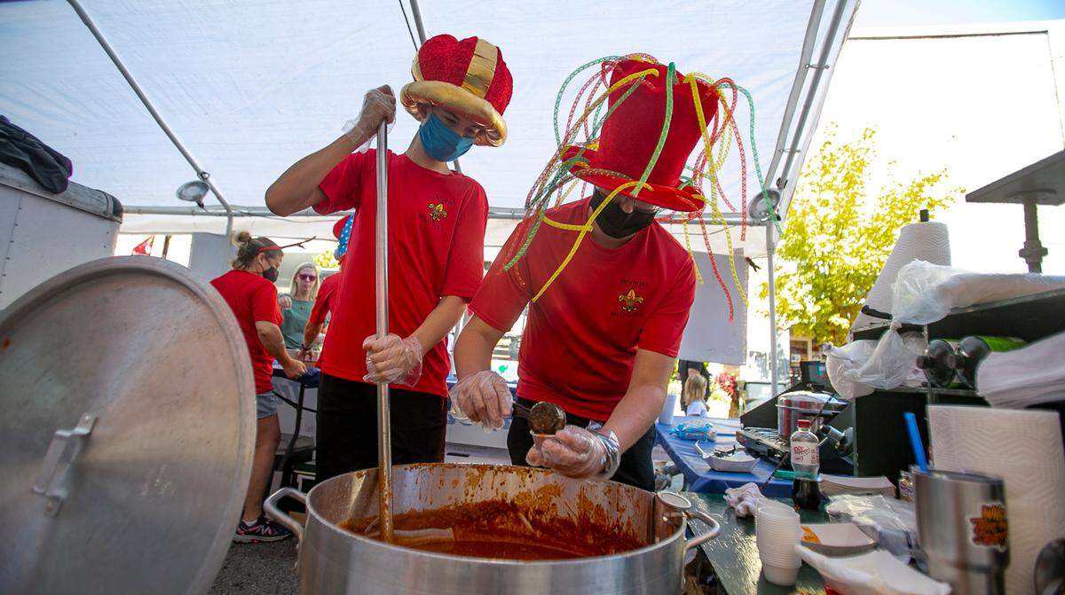 Boy Scouts Colton Yates and Andrew Reuting with Boy Scout Troop 553 out of Shiloh prepare chili for their customers.
