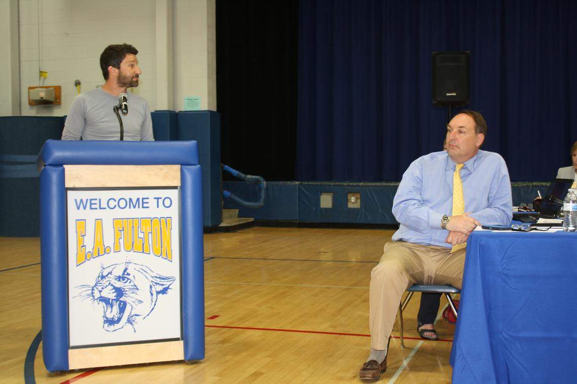 Joe Cipfl, 20-plus year science teacher at Fulton Jr. High, speaks directly to Steve Springer, (not shown), O'Fallon School District 90 board member under fire for recent comments on an O'Fallon Public Library program highlighting a children's book,  "Justice Makes A Difference: The Story of Miss Freedom Fighter," last month. At right, other board member Matt Lloyd.