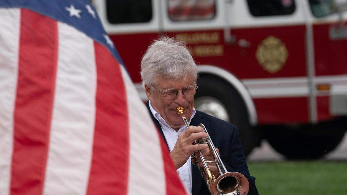 Dr. Thomas Berkner of Southwestern Illinois College plays “Taps” on the bugle on Sept. 11, 2023. The song is played on military installations at sunset and at the end of solemn events to pay respect to the end of life.