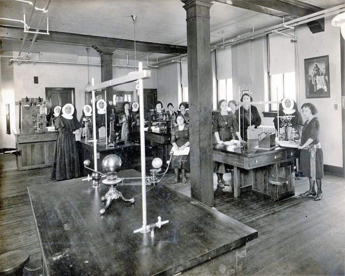 Nuns from the Adorers of the Blood of Christ convent in Ruma taught at St. Teresa’s Academy for girls in East St. Louis for decades. Here, they’re shown with students in a science lab.