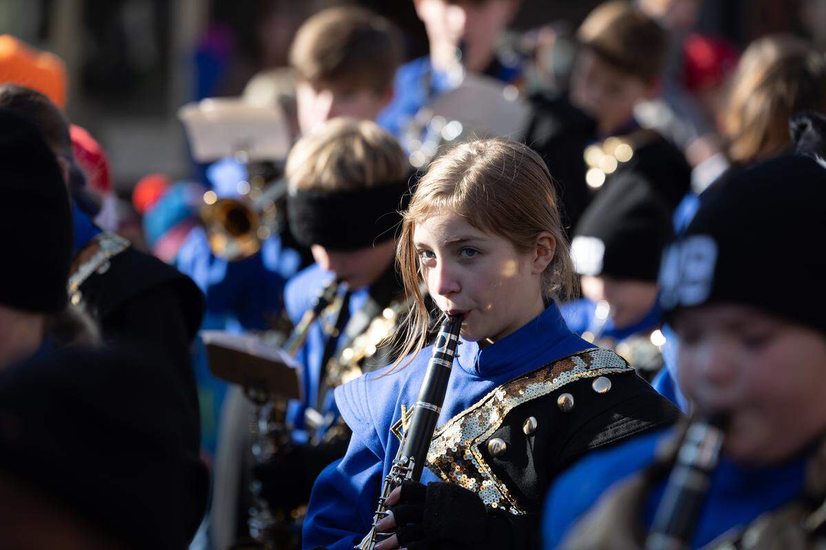 A Belleville East Lancer plays the clarinet during the 2025 Santa Parade.