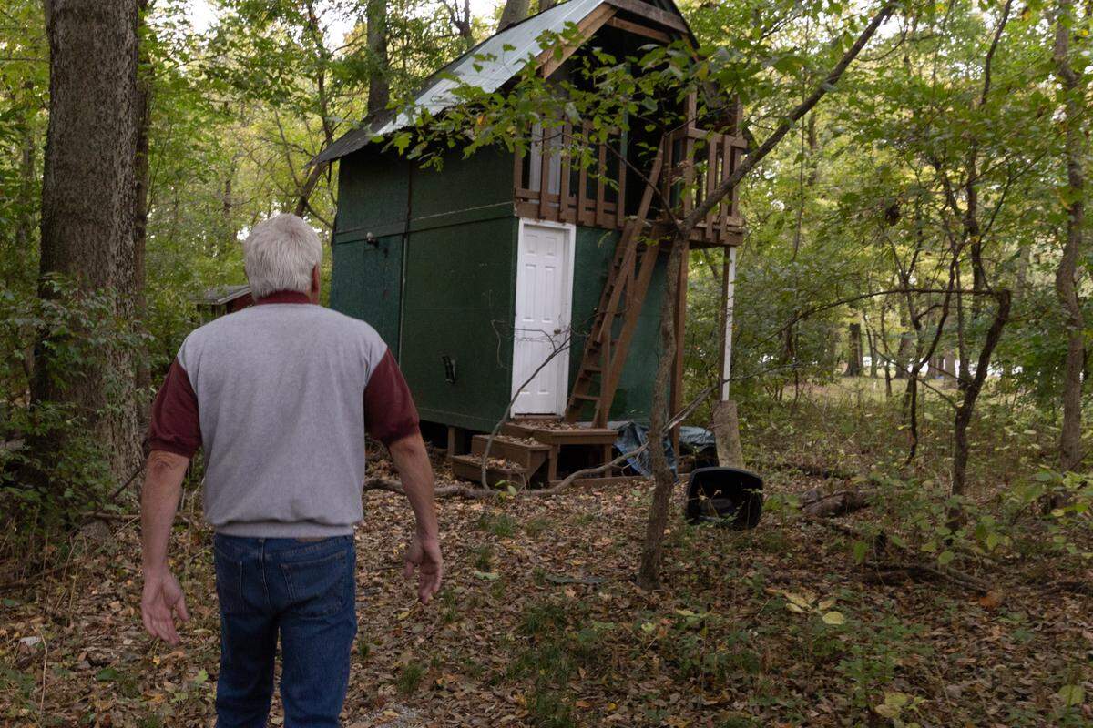 Kevin Link walks to a treehouse in woods behind his home in Pontoon Beach. That’s where he found his youngest child, Naomi Link, dead on Sept. 2, 2024. The 24-year-old died by suicide.