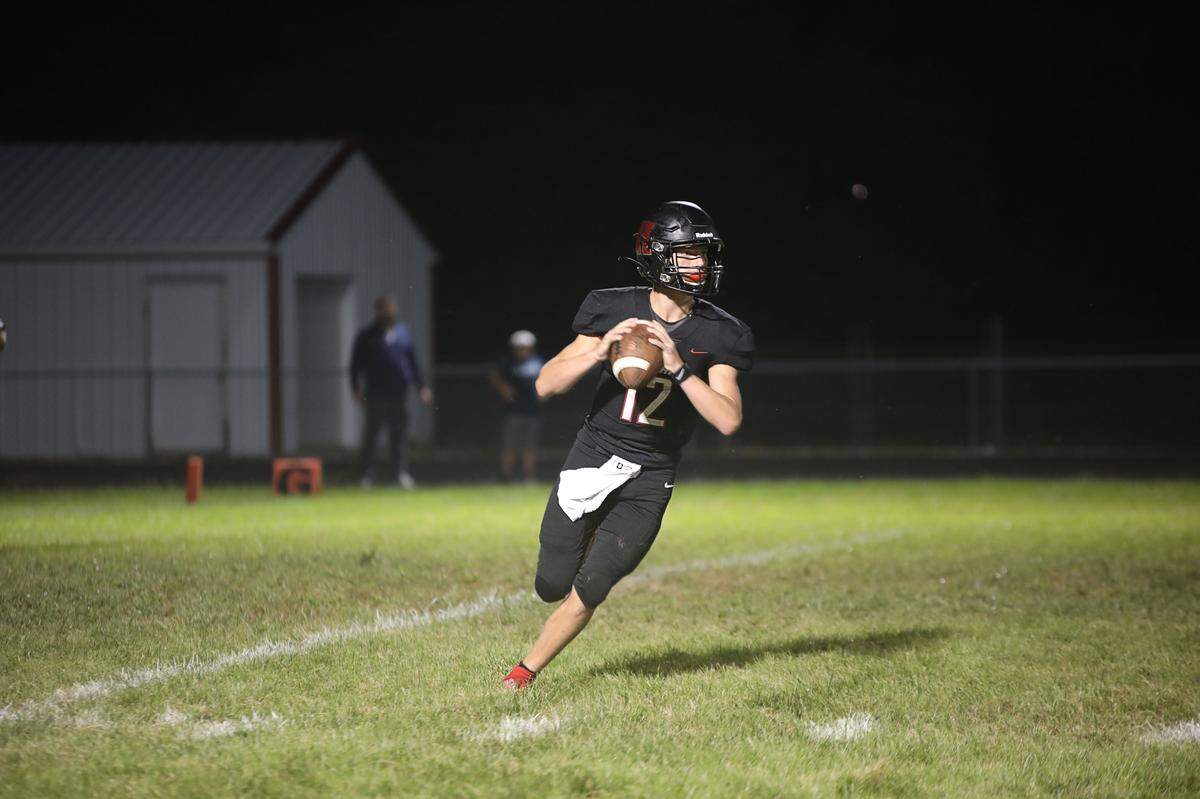 Highland quarterback Brent Wuebbels drops back to pass against Belleville East during a game his freshman season. fired three touchdown passes Friday, Sept. 9, in helping the Bulldogs to a decisive 55-14 home win against Marion.