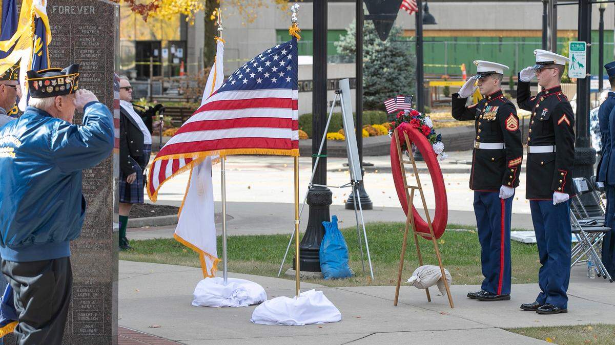 US Marines and veterans salute as Taps play in the background during the 23rd annual Veterans Day ceremony in Belleville. The event held in Downtown Belleville featured guest speaker Colonel Rob Lowe III, Vice Commander, 375th Air Mobility Wing, Scott Air Force Base and winners of the annual student poster and essay contest.