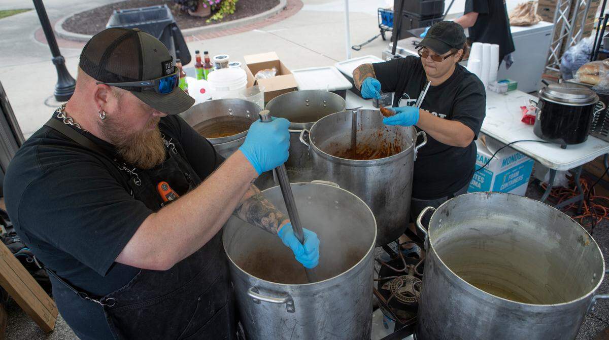 Beast BBQ owner, David Sandusky, and Loren Osegura prepare and serve chili at the 38th annual Chili Cook-Off. Over 40 vendors live entertainment and more highlighted this year’s event, which concluded Saturday night in downtown Belleville. Sandusky said his chili features a lot of dried peppers and locally sourced ground beef and chorizo processed at Beast Butcher and Block.