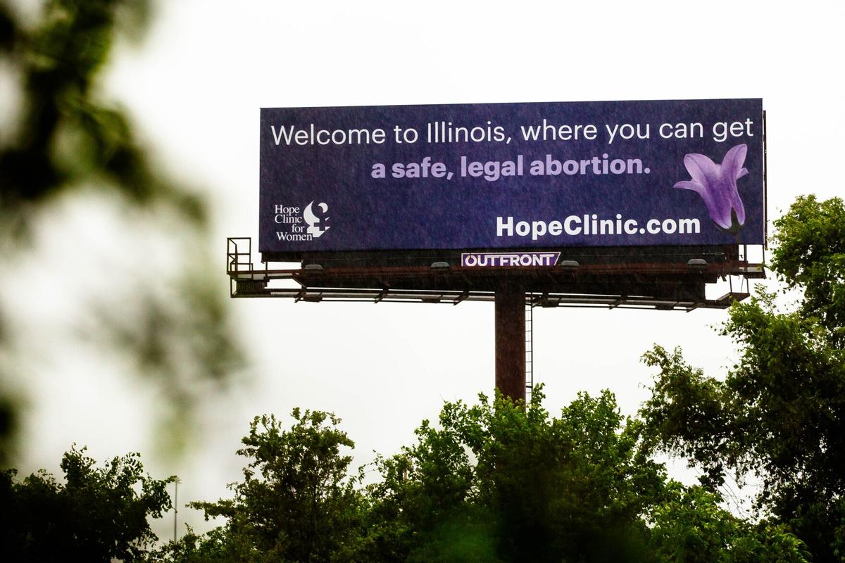 A billboard promoting the Hope Clinic for Women welcomes drivers to Illinois in East St. Louis, near the Missouri border. State officials, including Gov. J.B. Pritzker, have promoted Illinois as a destination for people seeking abortions as surrounding states have restricted access to the procedure. Missouri has a trigger law that would ban most abortions in the state if Roe v. Wade is overturned.