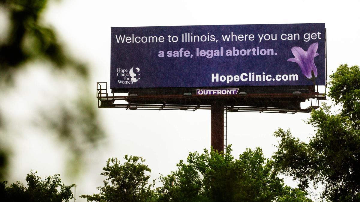 A billboard promoting the Hope Clinic for Women welcomes drivers to Illinois in East St. Louis, near the Missouri border. 