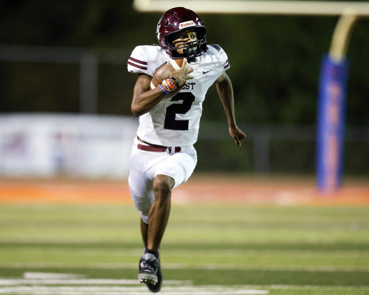 October 4, 2024 - East St. Louis Il, - Belleville West running back Troy McLean carries the ball during Friday night’s Southwestern Conference matchup between Belleville West and East St. Louis. [Photo: Chris Johns]