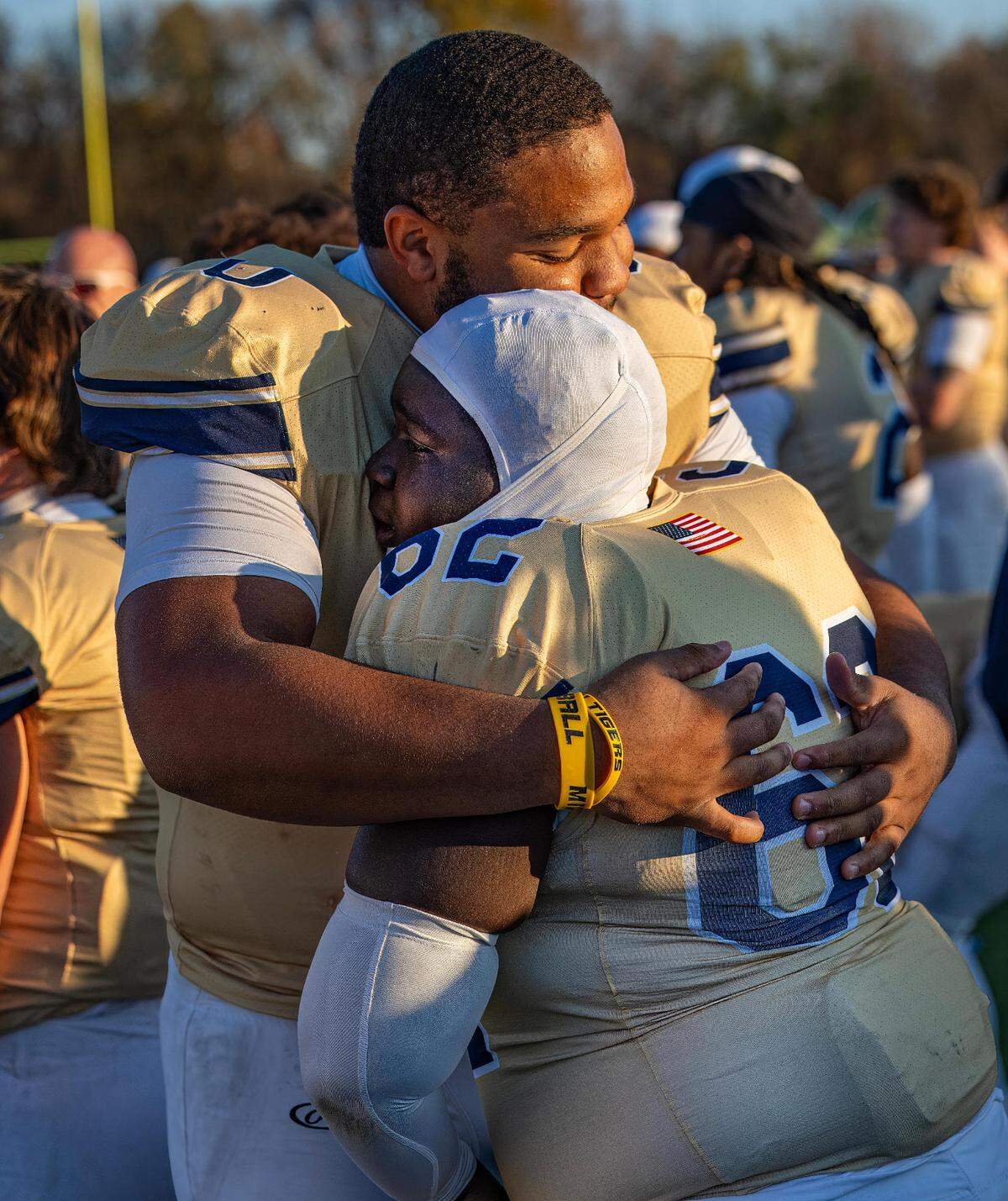 Althoff’s Jason Dowell (0) and Drew McGee (62) celebrate on the sideline a McGee scored by recovering a fumble in the end zone in the forth quarter on the IHSA Class 1A quarterfinal game Saturday.