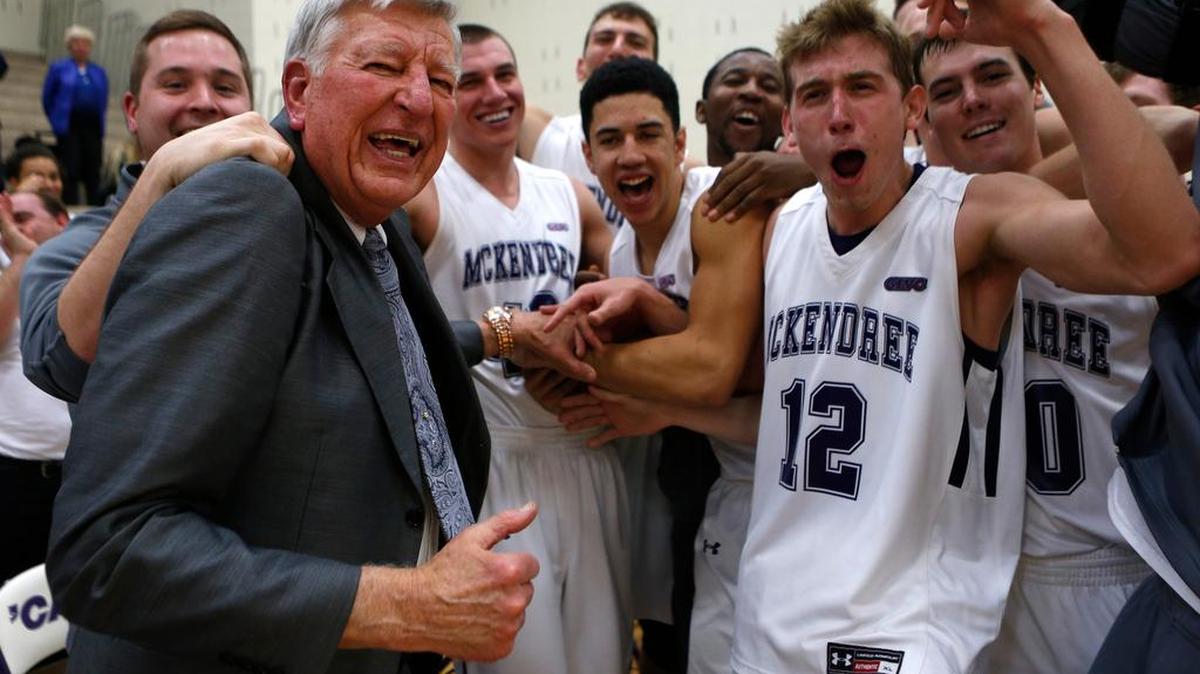 McKendree head coach Harry Statham is mobbed by his players after their win over Wisconsin-Parkside on Thursday at McKendree University. Statham is tied with the all-time mark for college basketball victories at the four-year level — men’s or women’s, all divisions — which was established by former University of Tennessee women’s coach Pat Summitt. See a gallery of photographs from the game and a video at bnd.com.