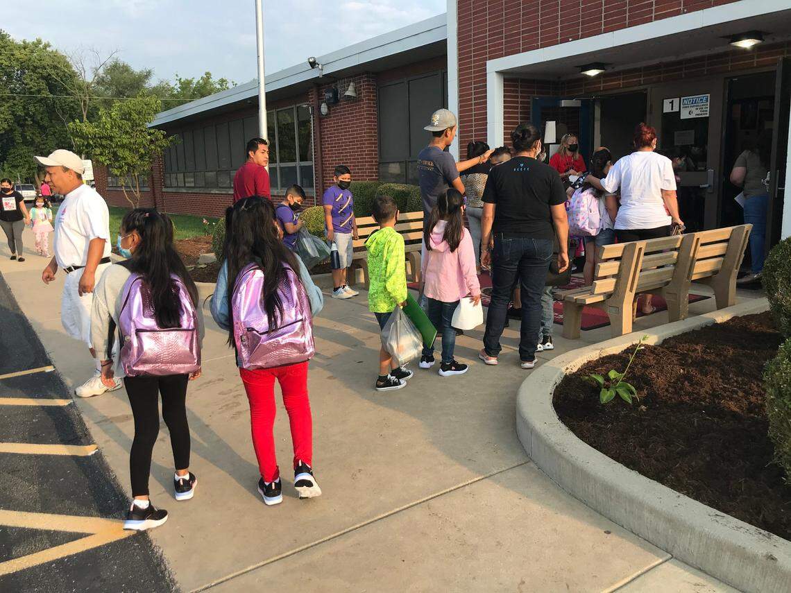 Parents drop off their children on the first day of school Wednesday at Kreitner Elementary School in Collinsville.