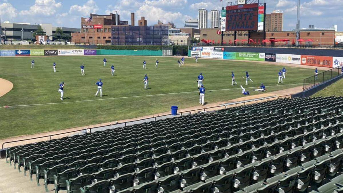 The Columbia baseball team warms up prior to their semifinal game in the IHSA Class 2A state tournament. The Eagles face Joliet Catholic Academy in the championship game Saturday night.