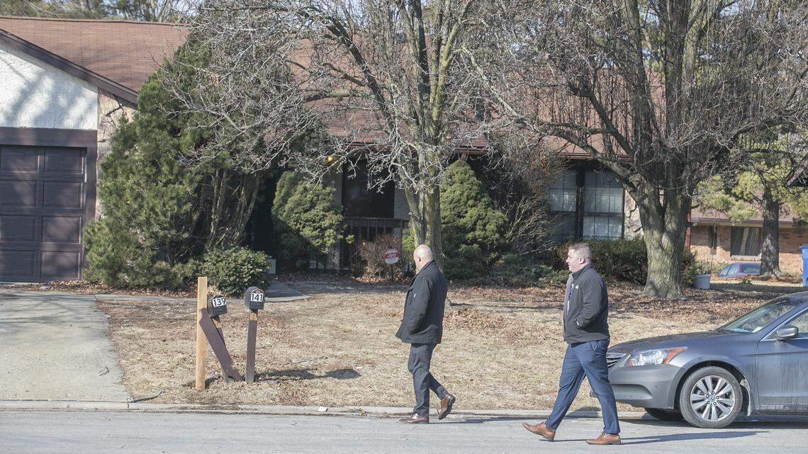 Investigators walk past 141 Paulette Drive in Belleville on Tuesday morning.  The Major Case Squad was activated Monday evening to continue the investigation into  a fatal shooting, which police believe occurred at 141 Paulette Drive in Belleville.