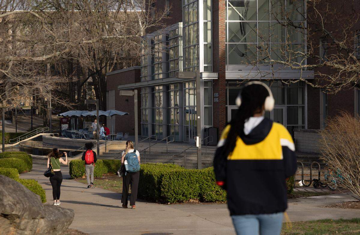Students walk across the campus of SIU March 19, 2025 in Carbondale, Illinois. (Julia Rendleman for ProPublica)