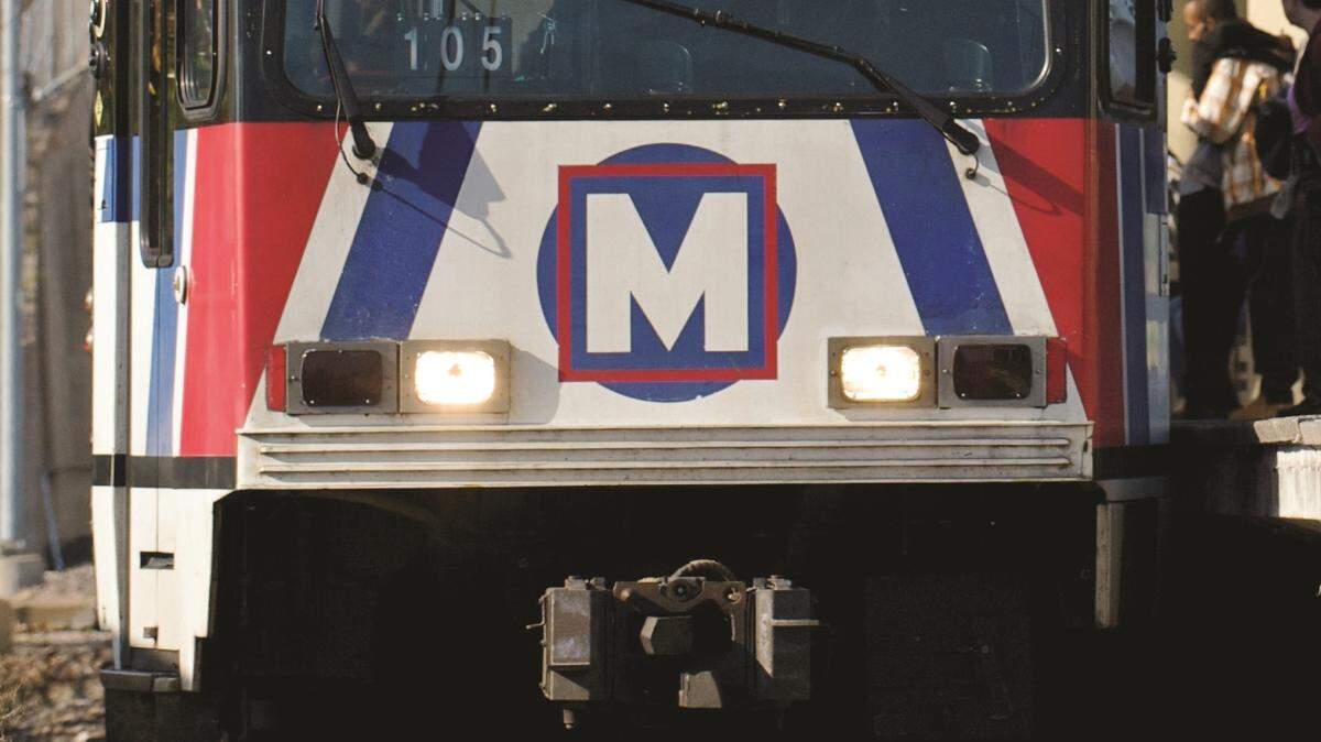 A MetroLink train stops for passengers at a station in Southern Illinois.