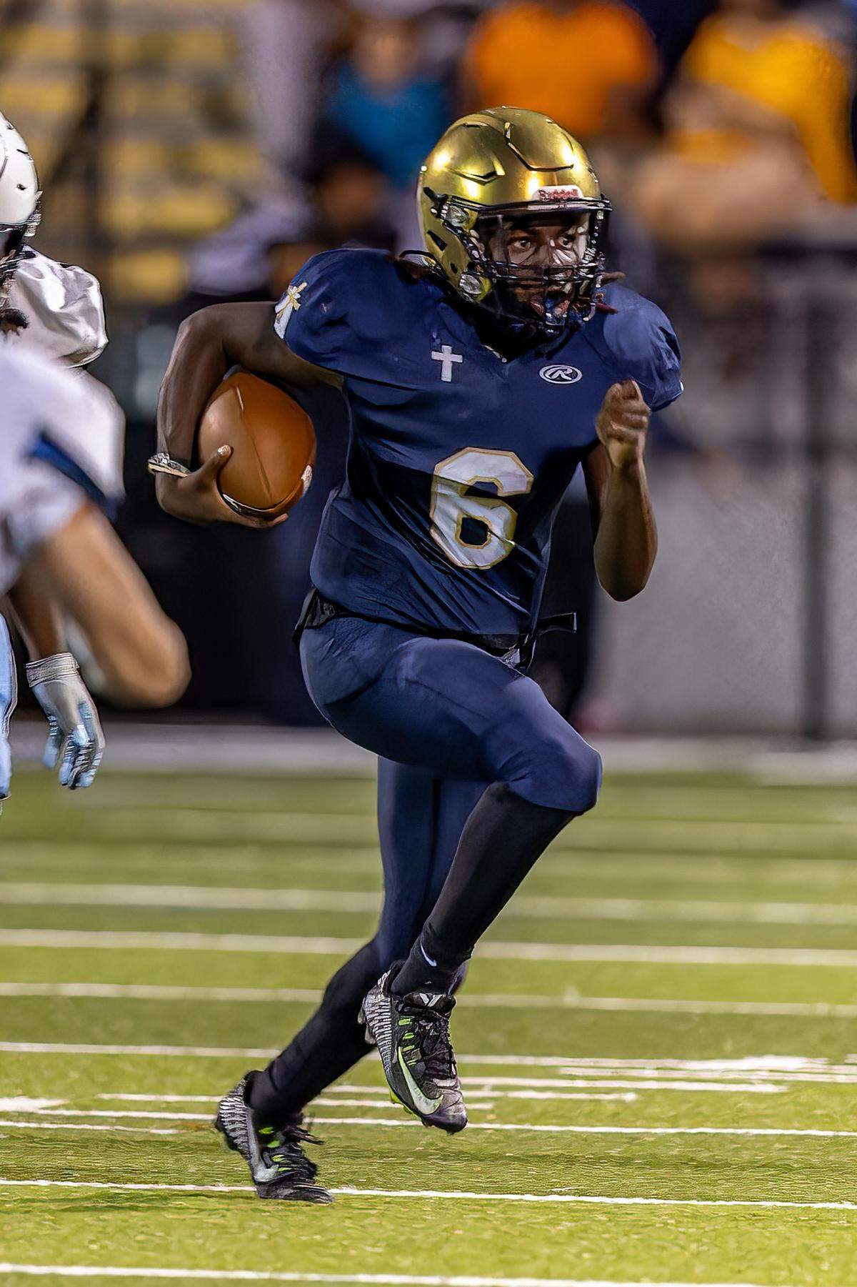 September 13, 2024 - Belleville, IL - Althoff Jayden Ellington (6) carries the ball during a boys football game between Althoff and Belleville East on Friday Sept 13, 2024 at SWIC Southwestern in Belleville IL. [Photo: Jimmy Simmons]