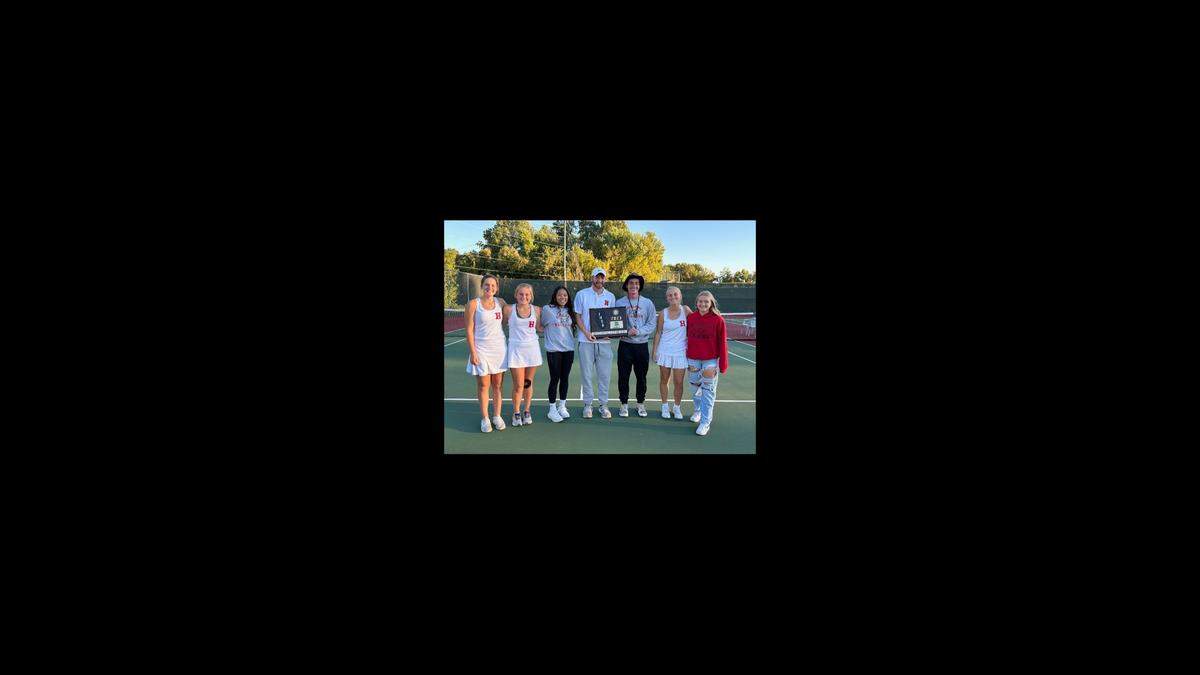 The Highland girls tennis team celebrates after winning the Class 1A sectional championship on Monday at Althoff Catholic High School in Belleville.