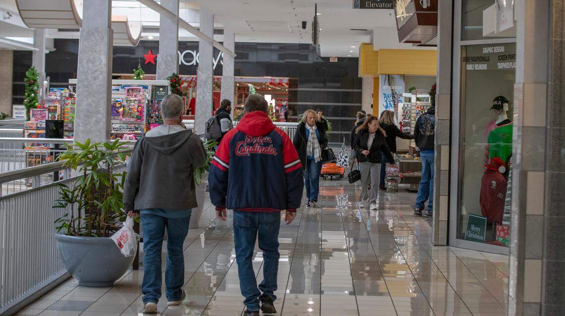 Shoppers walk the corridor outside Macy’s at St. Clair Square in Fairview Heights on Monday morning. Mall hours will be slightly expanded for the holiday season starting Sunday.