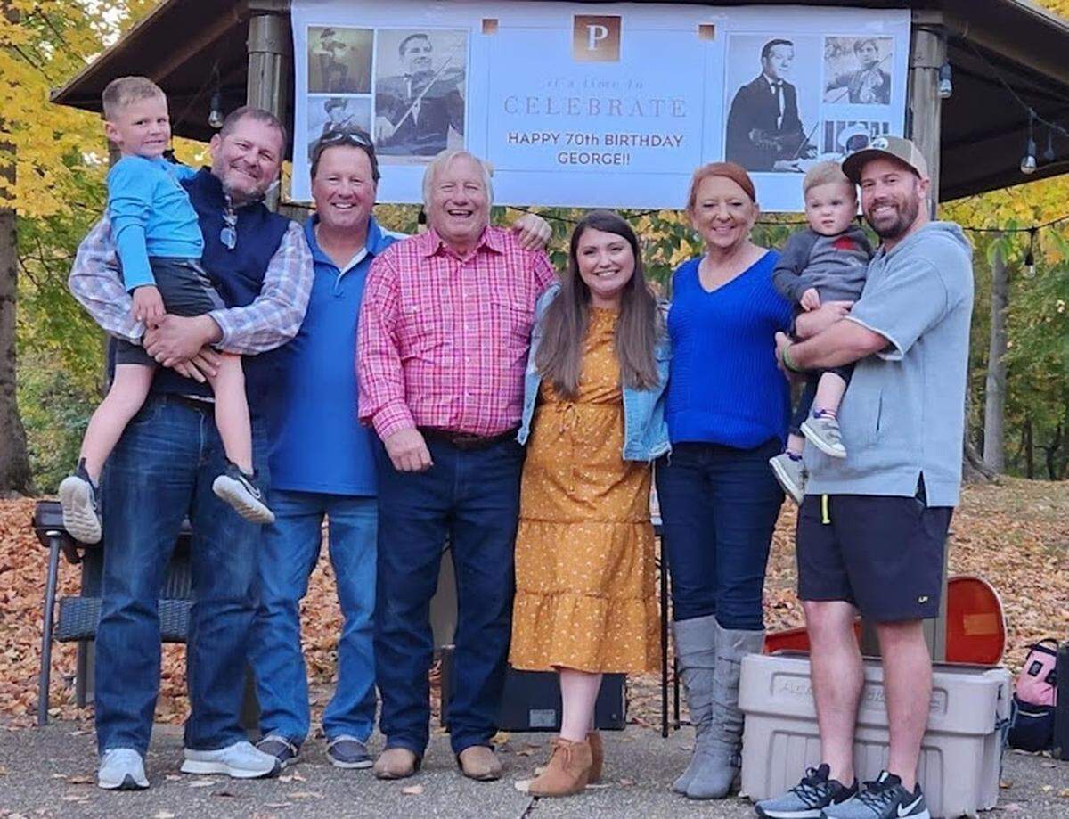 George Portz, fourth from left, celebrated his 70th birthday last year with, left to right, son Jason Portz (holding grandson Mason), nephew Todd Sine, daughter Kaitlin Huelsman, significant other Deanna “Dee” Hardgrave and son-in-law R.J. Huelsman (holding grandson Trae).