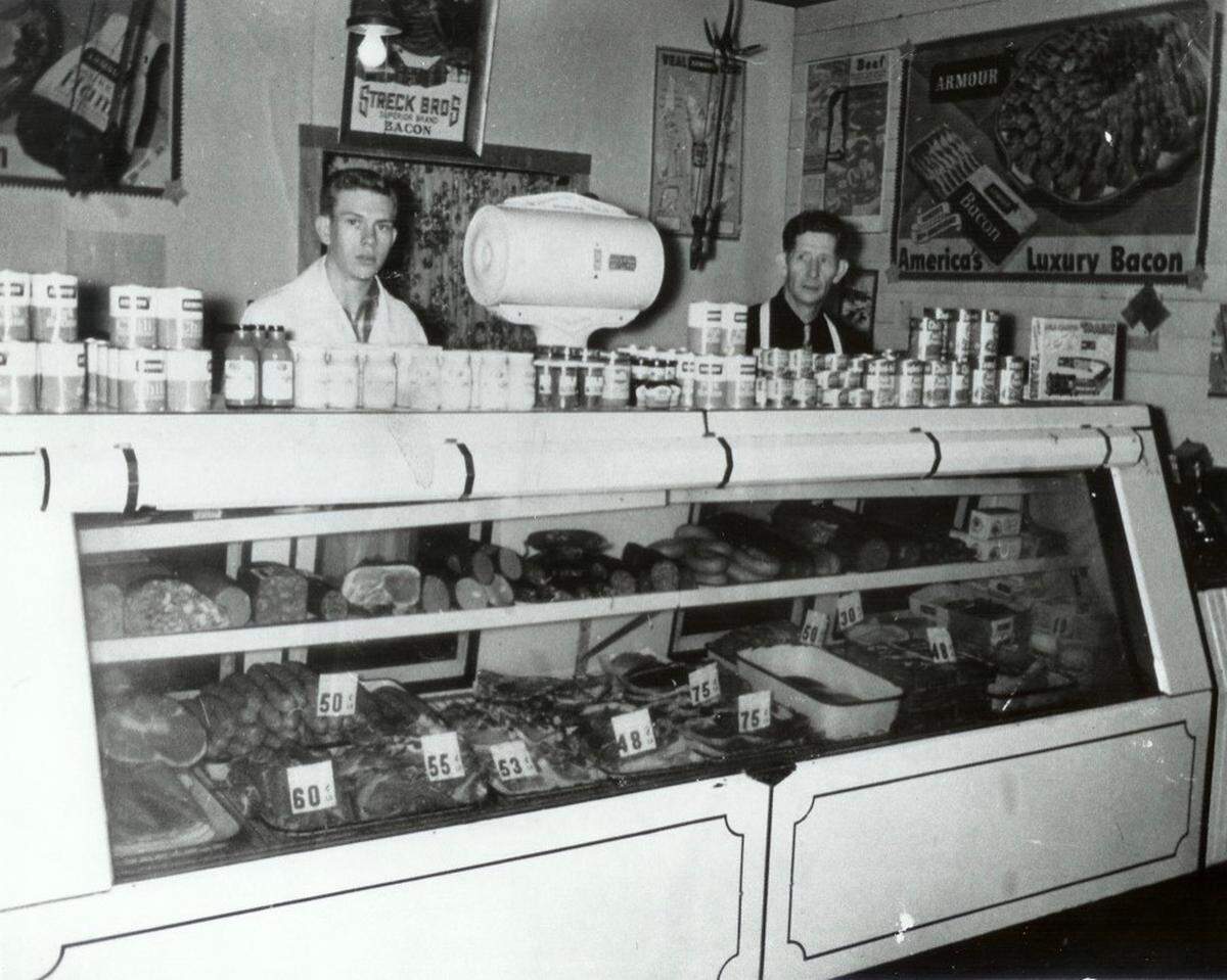 Tom Norrenberns, left, works with his father, Ben Norrenberns, in the late 1940s at a small butcher shop in Albers that Ben had opened in 1930. Tom and his wife, Betty Ann, went on to operate 12 Tom’s Supermarket stores in southern Illinois.