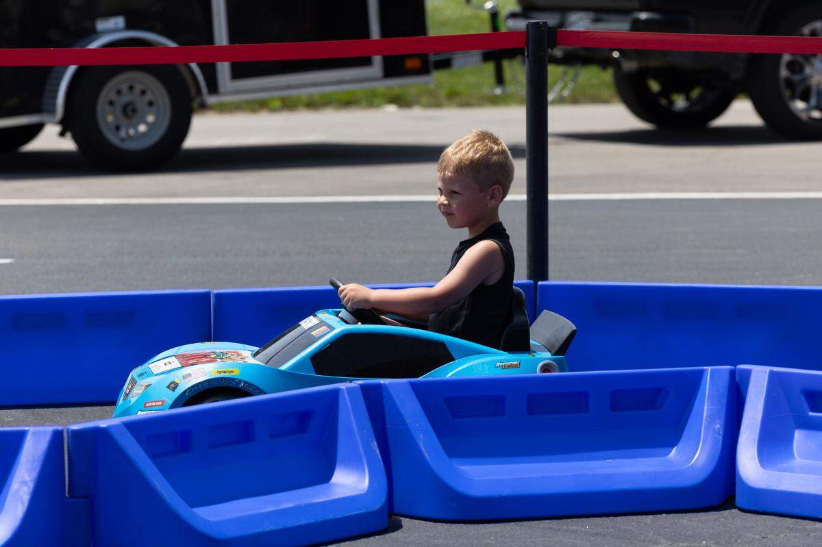 A young race fan drives a much safer and less regulated track prior to the the Enjoy Illinois 300 Cup Race at WorldWide Technology Raceway in Madison, Ill. on June 1, 2024.