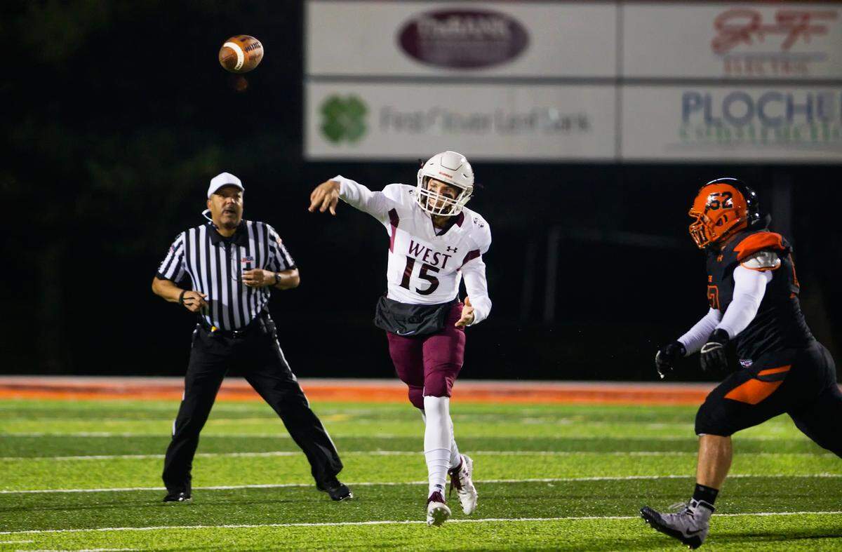 Belleville West Jack Mccloskey (15) throws the ball during Friday’s game at Edwardsville High School.