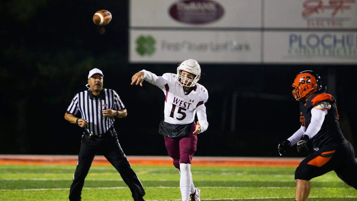  Belleville West Jack Mccloskey (15) throws the ball during Friday’s game at Edwardsville High School.
 